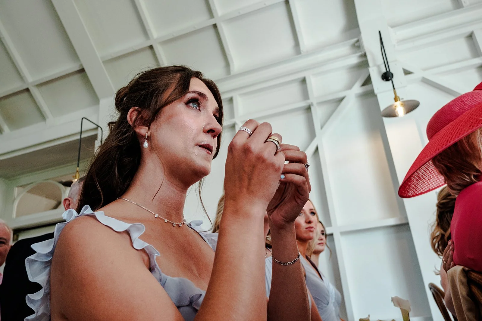 Jack and Abi exchanging vows at the altar in Limekiln's ceremony barn, guests watching on