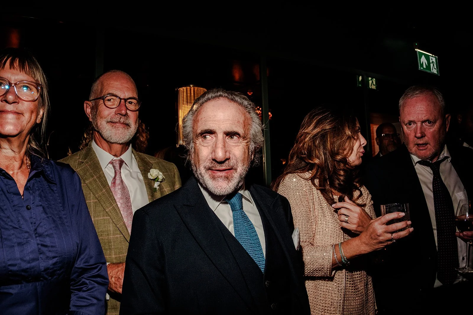 Guests enjoying the evening atmosphere at the Limekiln wedding reception — candid and warm