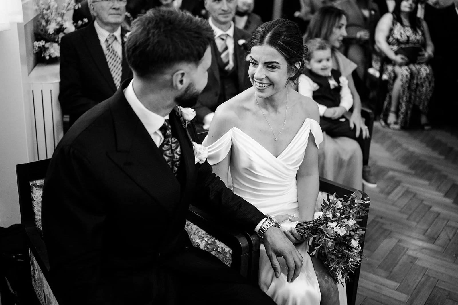 Nat and Josh laughing together during their ceremony