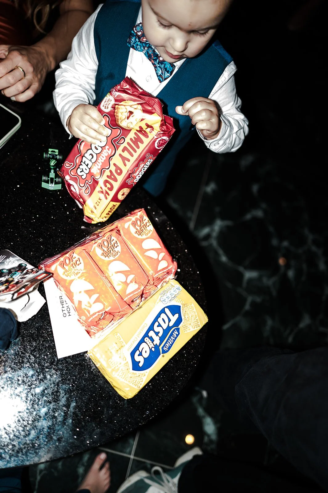 Child raiding the snack table at the reception