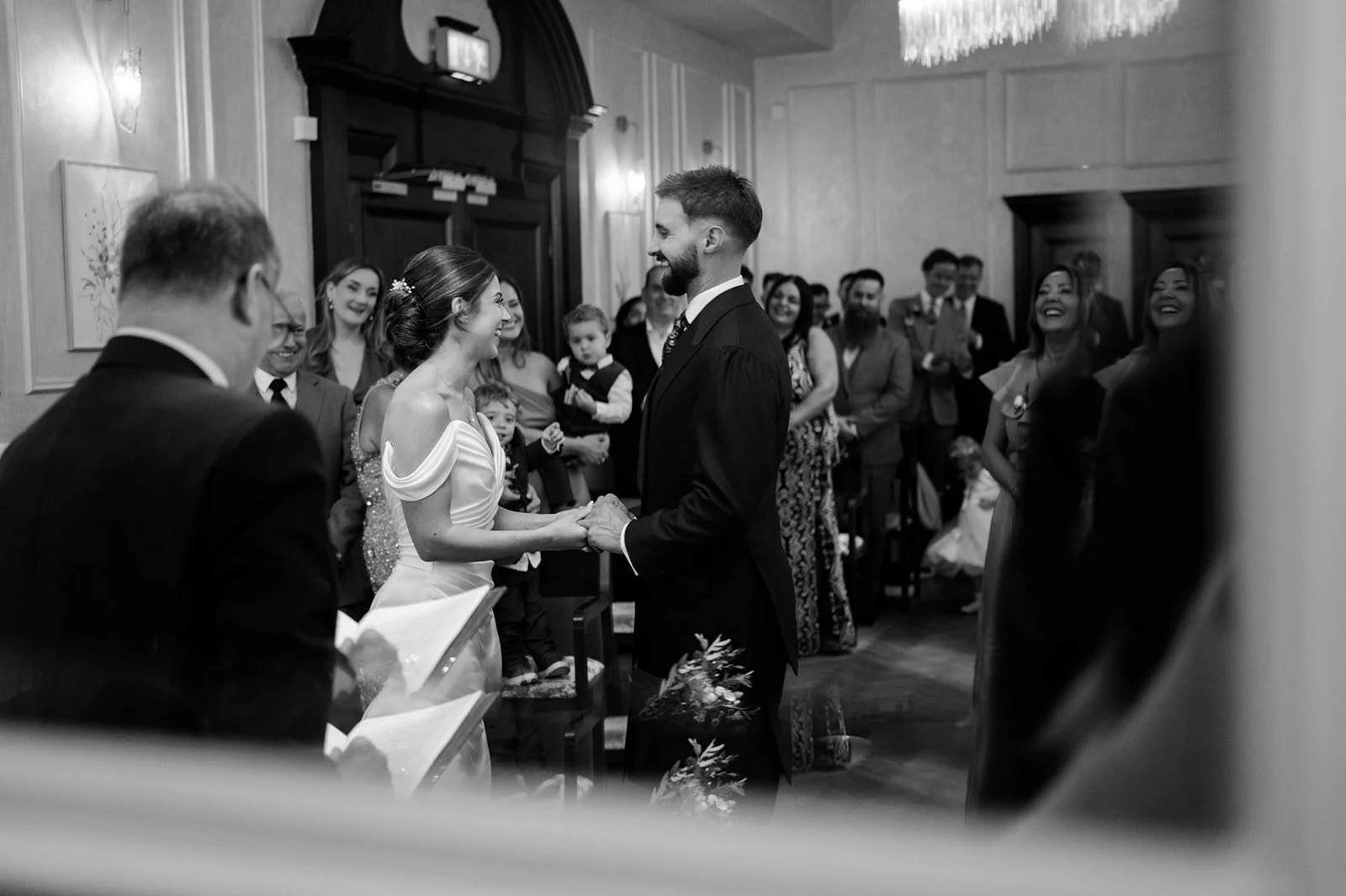Nat and Josh exchanging vows, candid moment through the crowd
