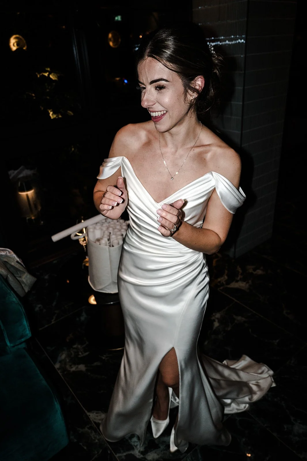 Nat laughing and dancing at the reception