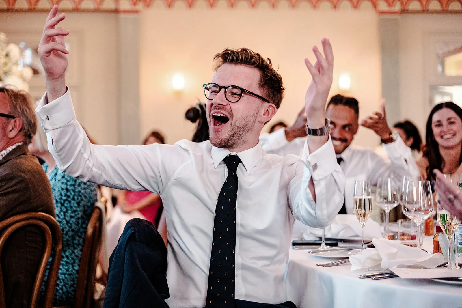 Guests reacting with emotion and laughter during the speeches at Jack and Abi's Limekiln wedding reception