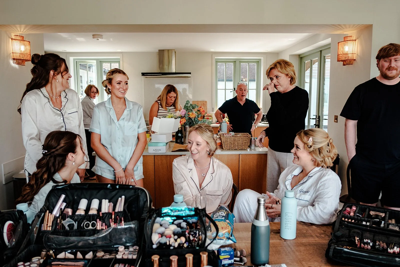 The whole bridal party gathered together in the getting-ready suite at Limekiln — smiles, laughter and excited energy