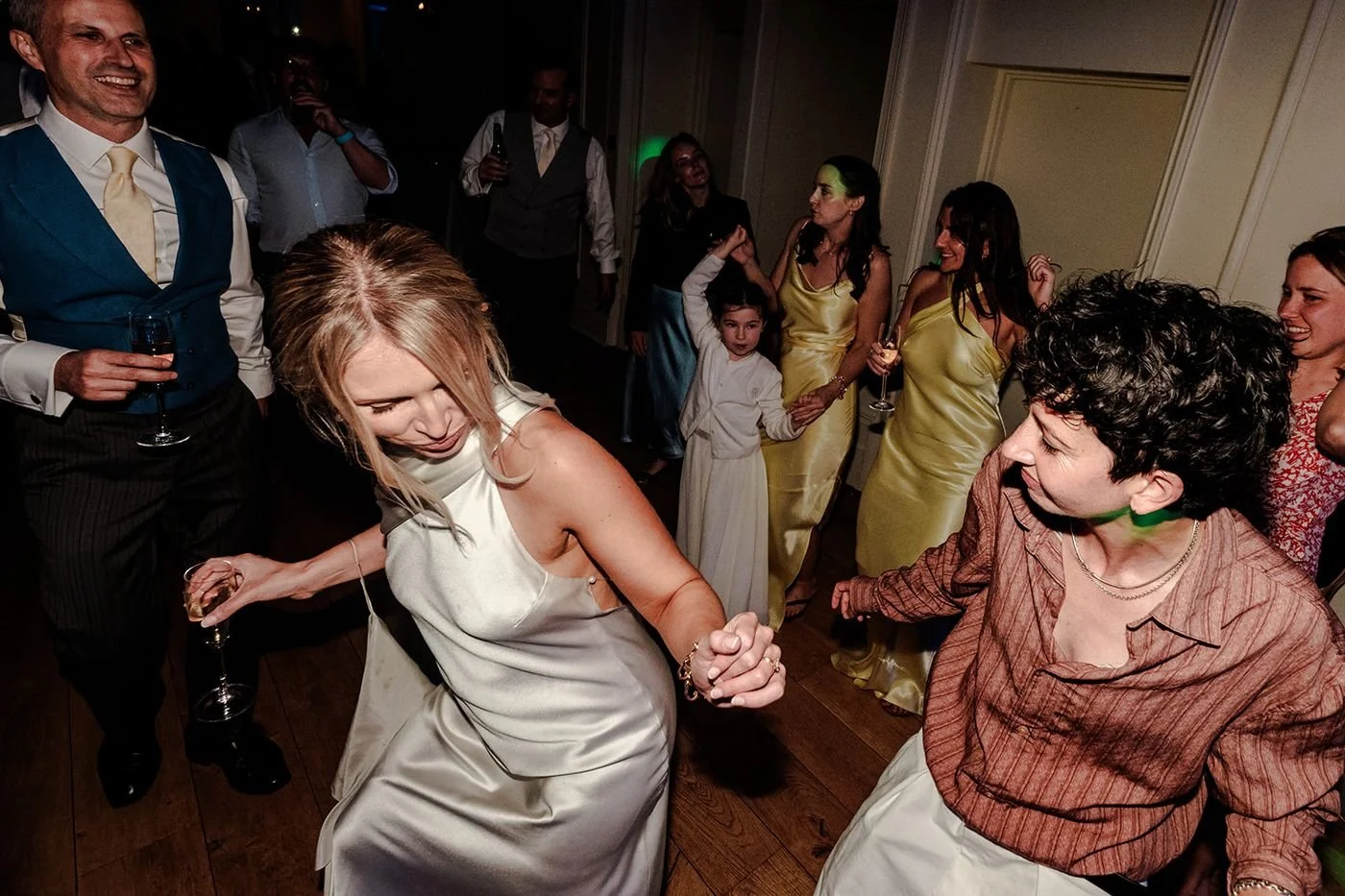 Alis and Brad surrounded by friends on the dance floor at Hotel du Vin Tunbridge Wells