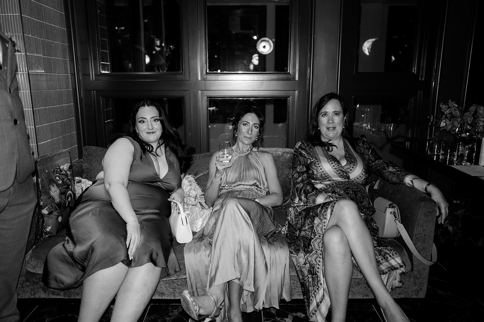 Guests relaxing on the sofa at The Other House