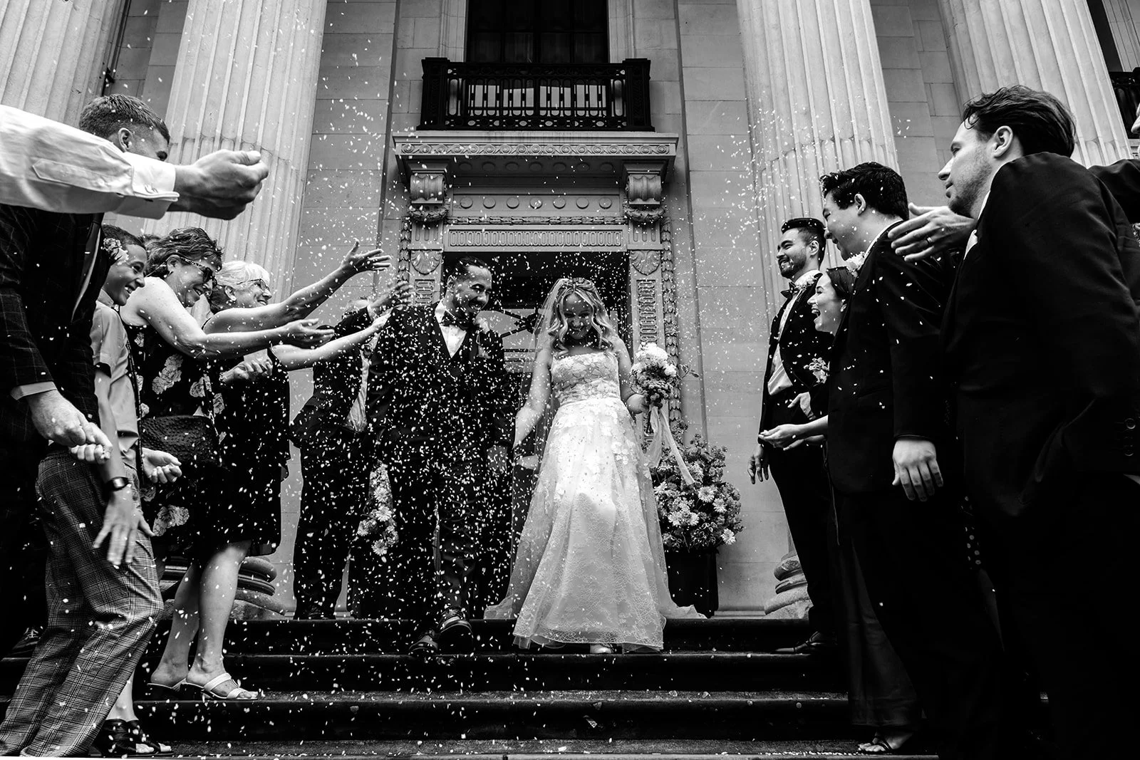 Shannon and Mark celebrating their Marylebone Town Hall wedding — unscripted and genuine
