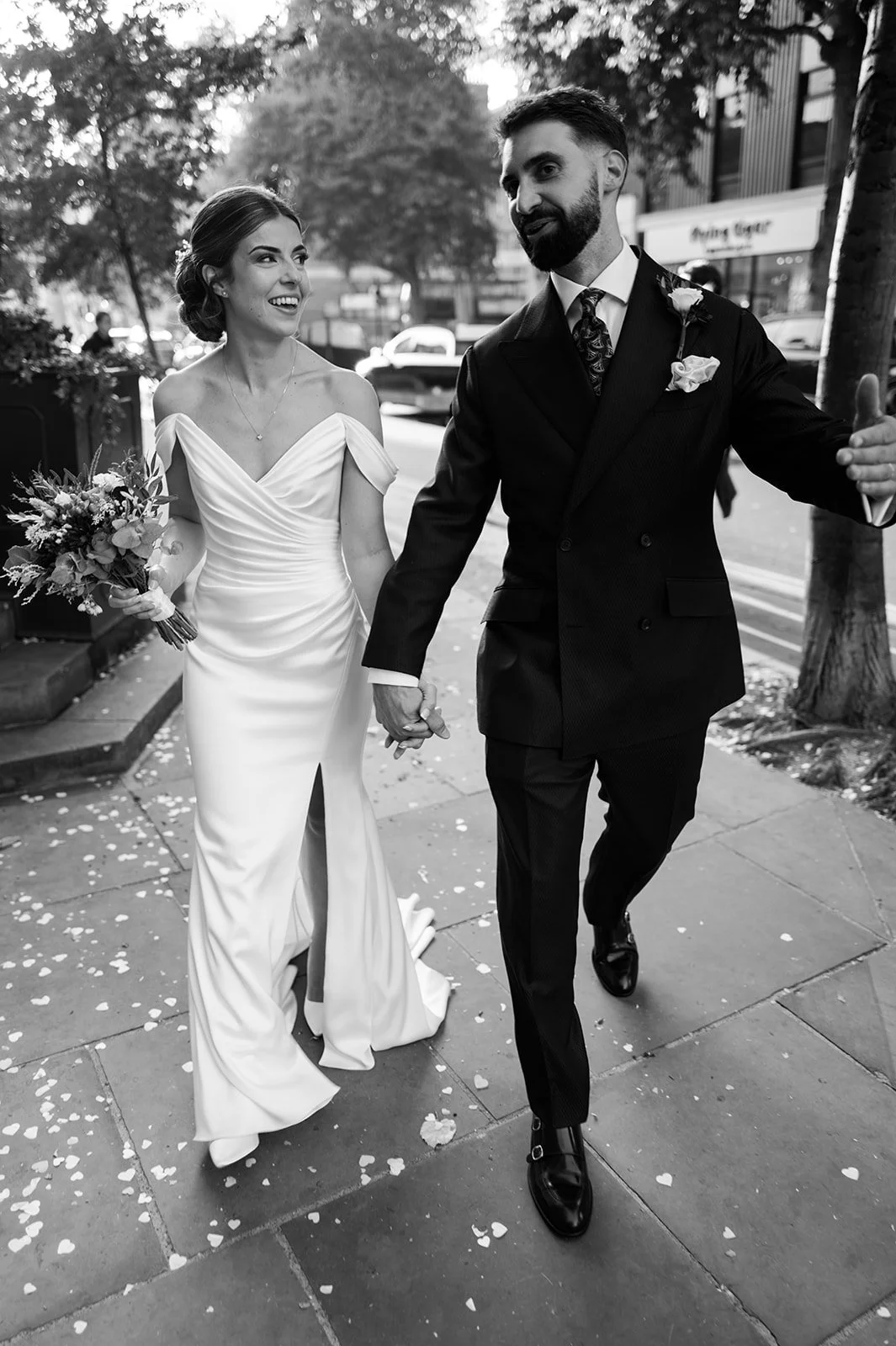 Nat and Josh walking through Chelsea after the ceremony