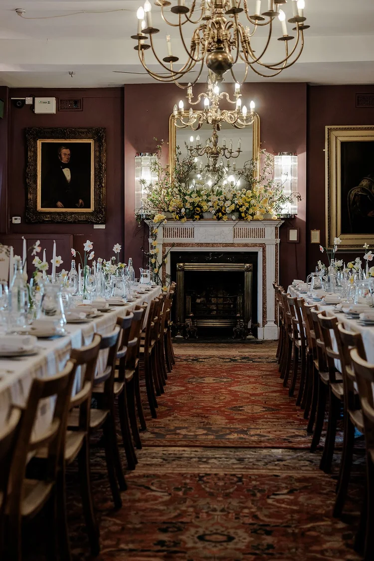 The chandelier-lit dining room at Brunswick House set for a wedding breakfast