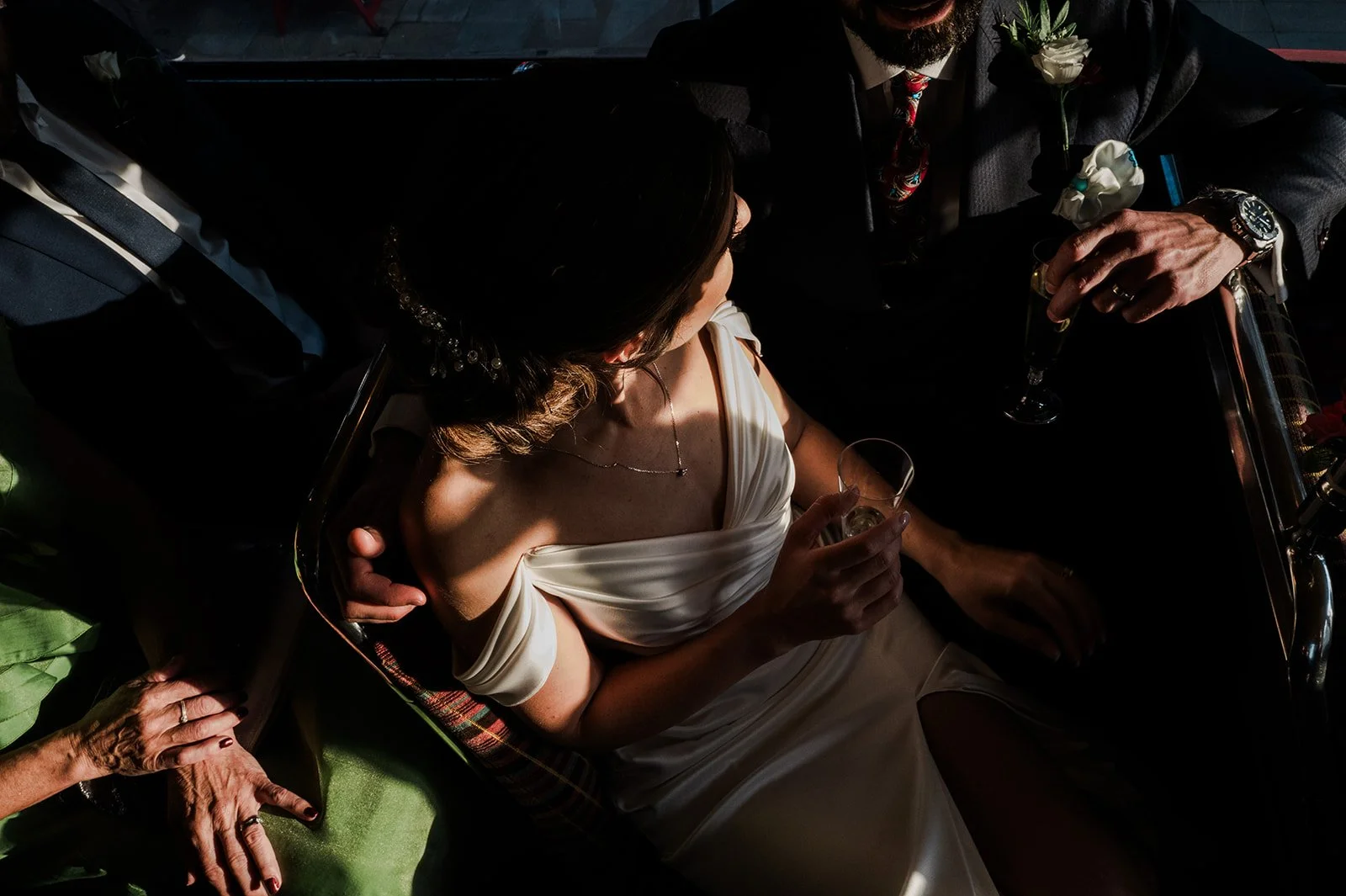 Beautiful overhead shot of Nat in dramatic light on the bus