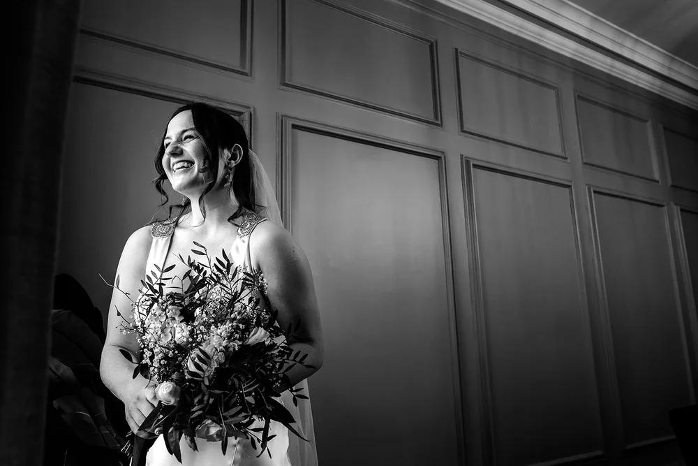 Lizzie and James sharing an intimate moment on their wedding day &mdash; emotive black and white documentary photography