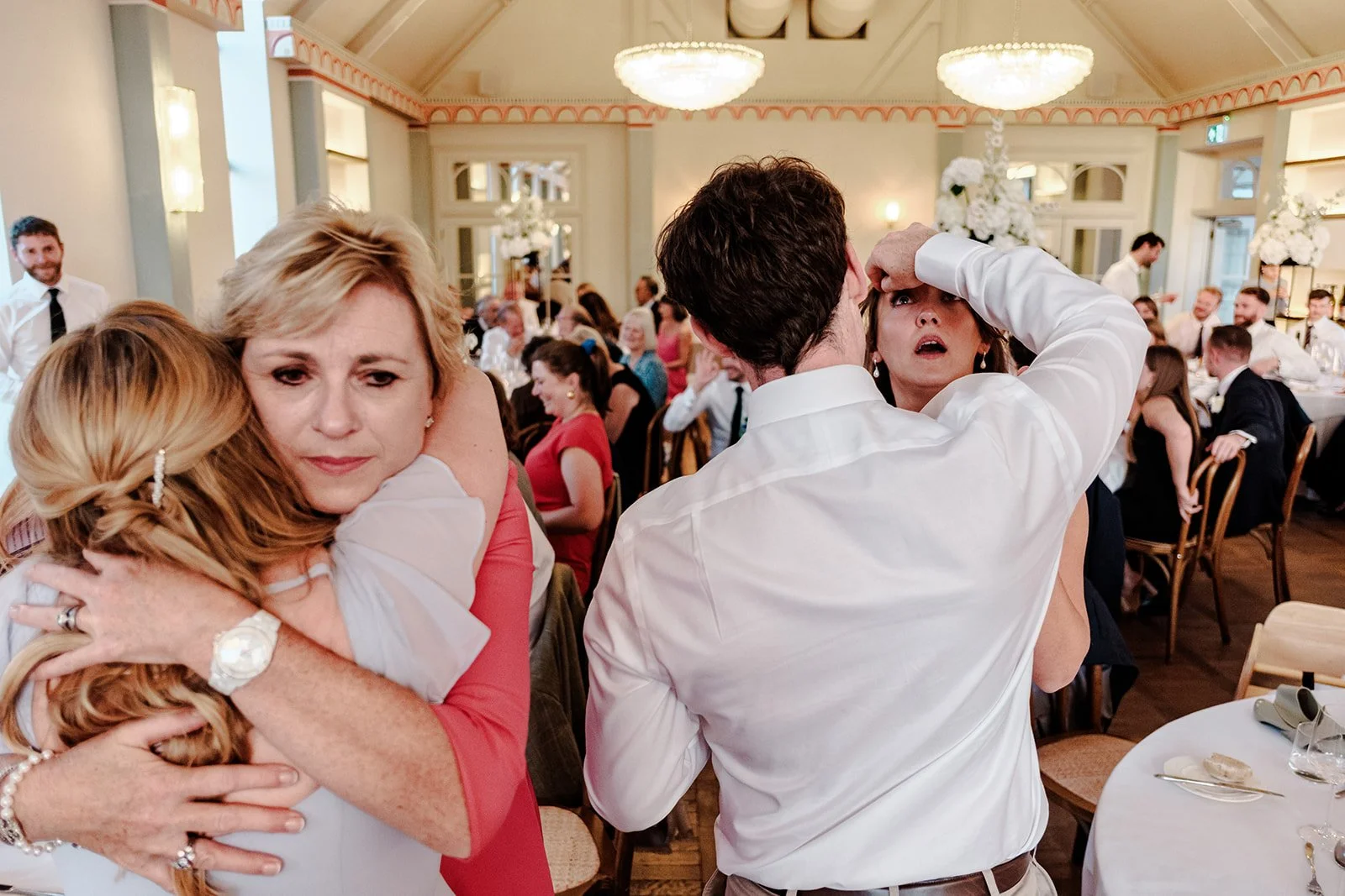 Guests embracing emotionally at the Limekiln wedding reception — a warm and genuine moment of connection
