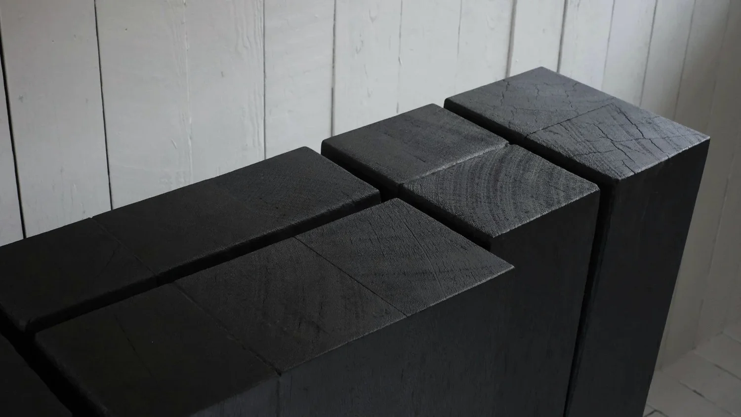 Close-up of the segmented burned wood top of the Hallway Table by Arno Declercq.