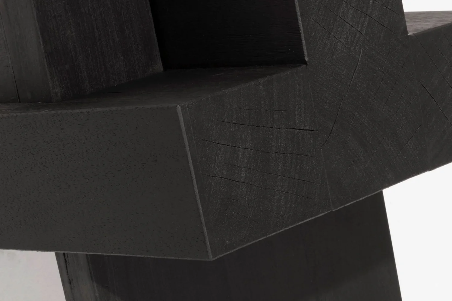 Close-up of the carved Iroko joint of the AD Bench 2.0 by Arno Declercq.