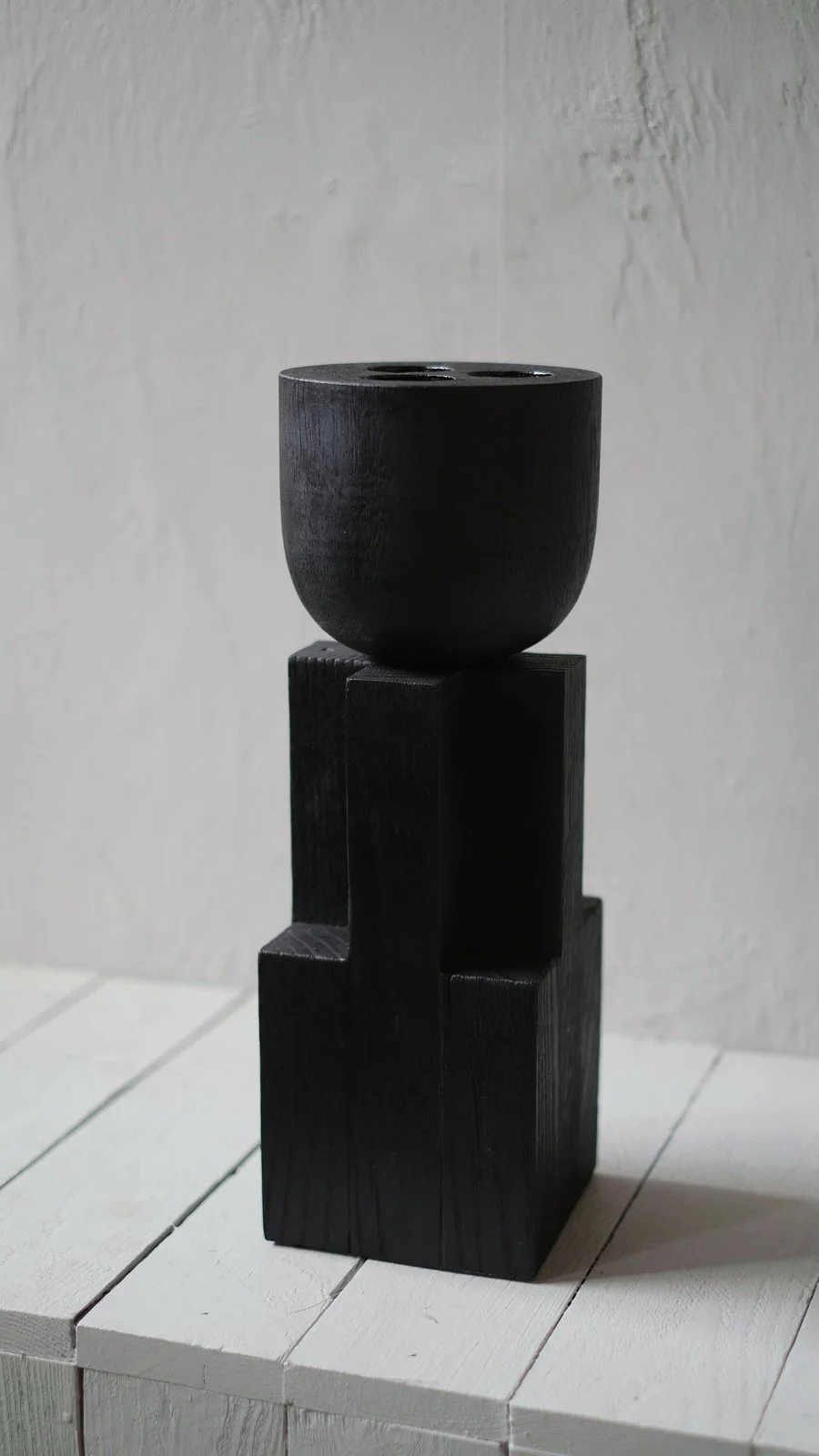 Closer view of the burned oak bowl and geometric base of the Goblet Bowl by Arno Declercq.