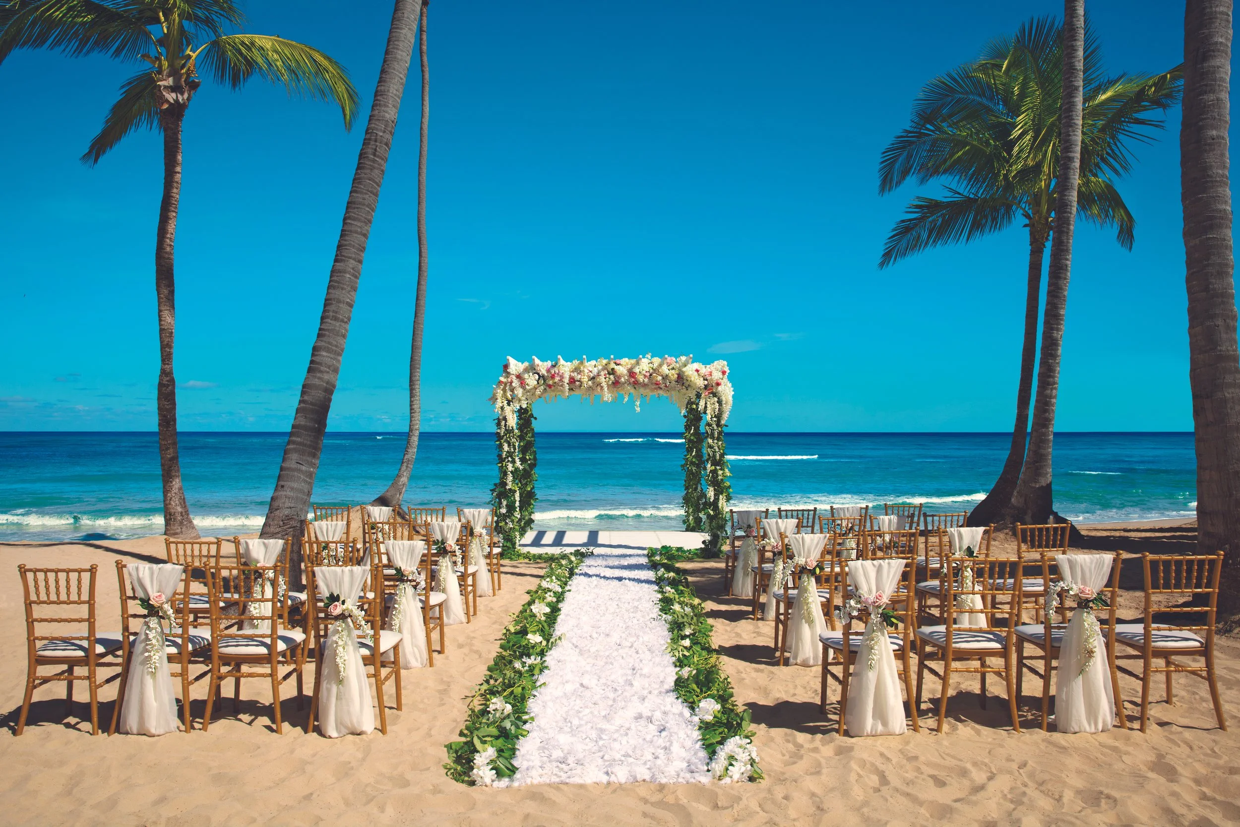 Beach destination wedding ceremony setup at an all-inclusive resort
