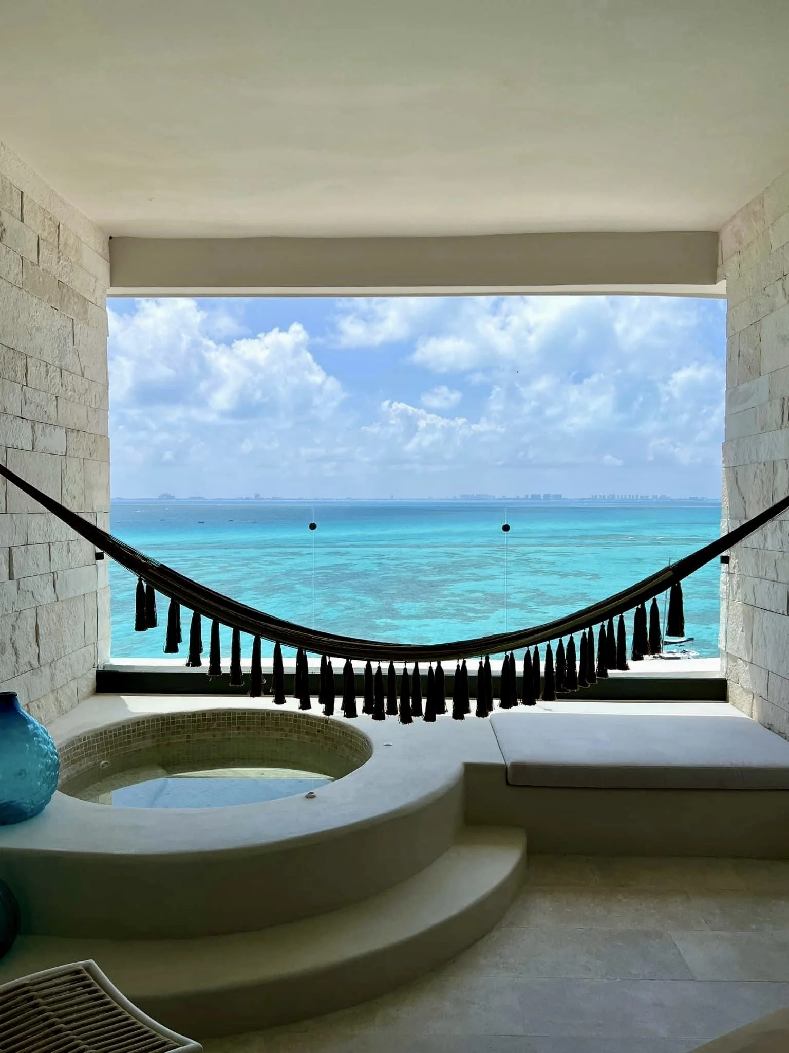 Tropical Mexican coastline and resort area with blue water and palm trees