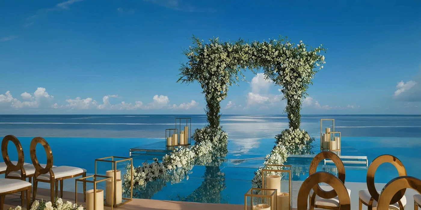 Dreams Natura Infinity Pool over the water wedding ceremony platform in Riviera Maya