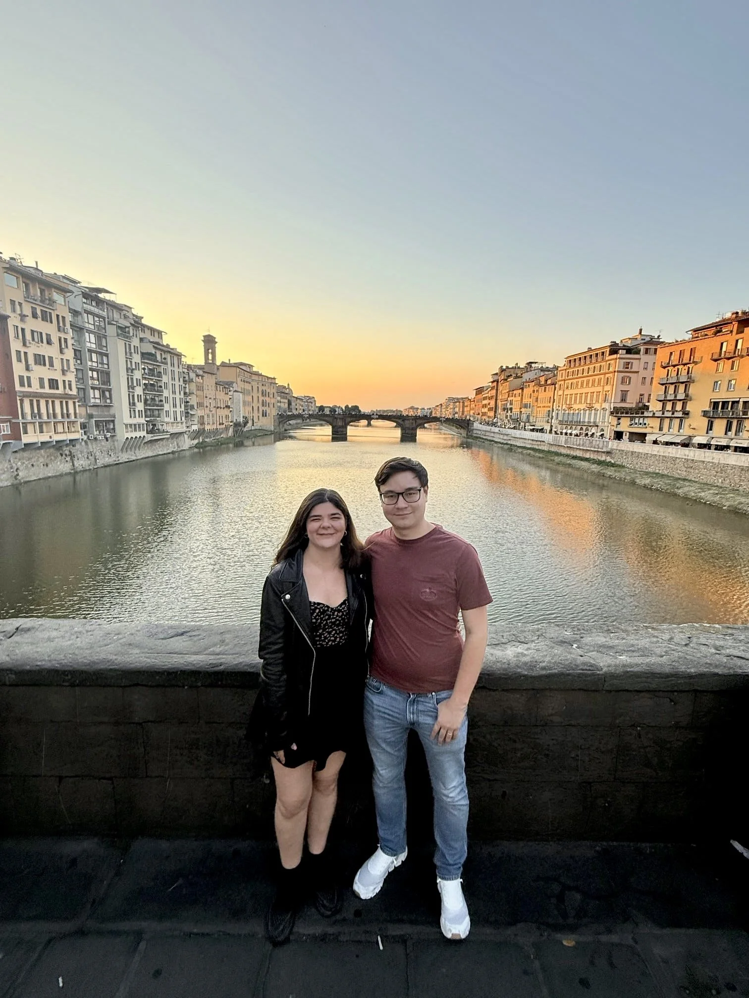 Couple walking along cobblestone streets in Europe