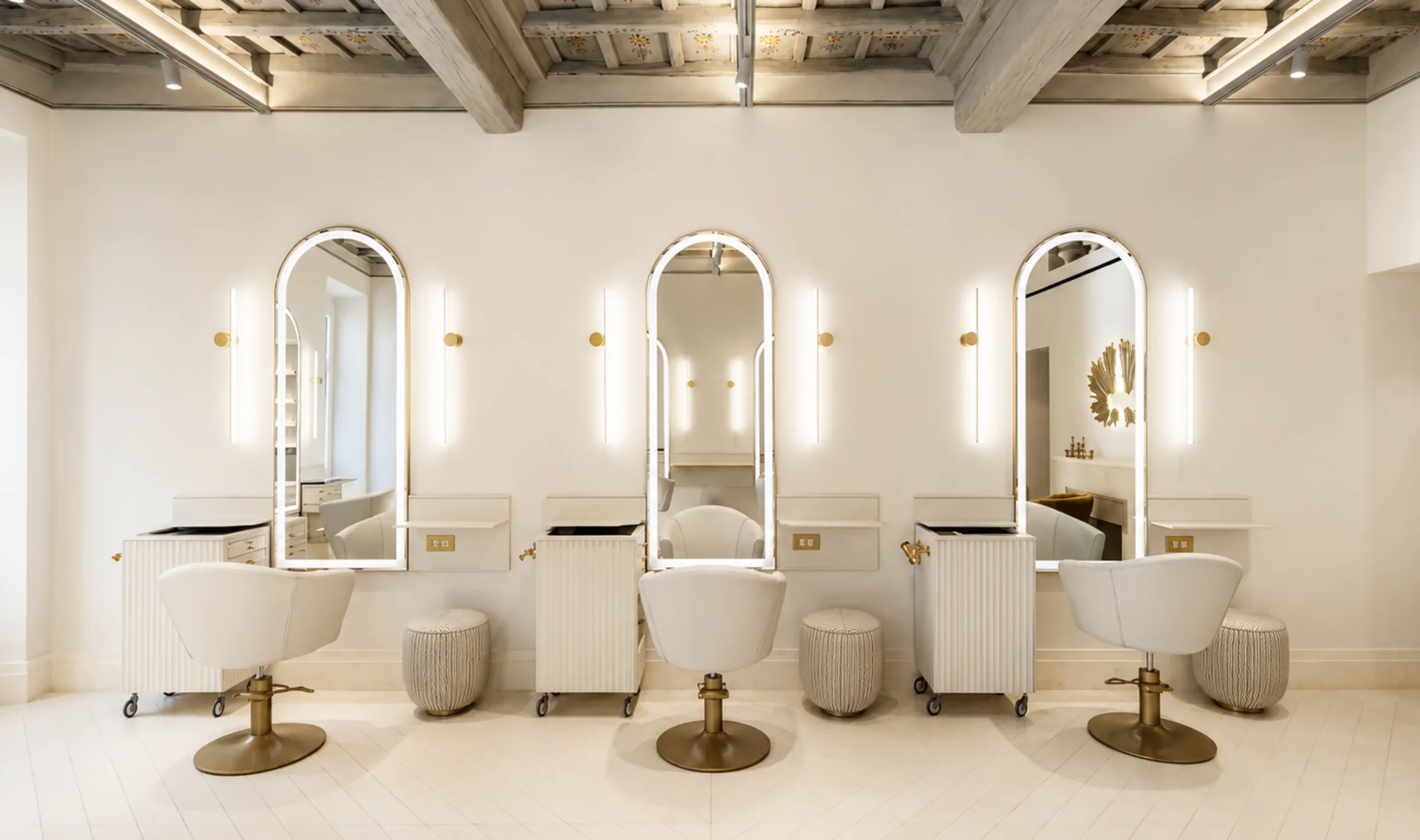 Arched mirror styling stations at the Bartorelli salon in Rome