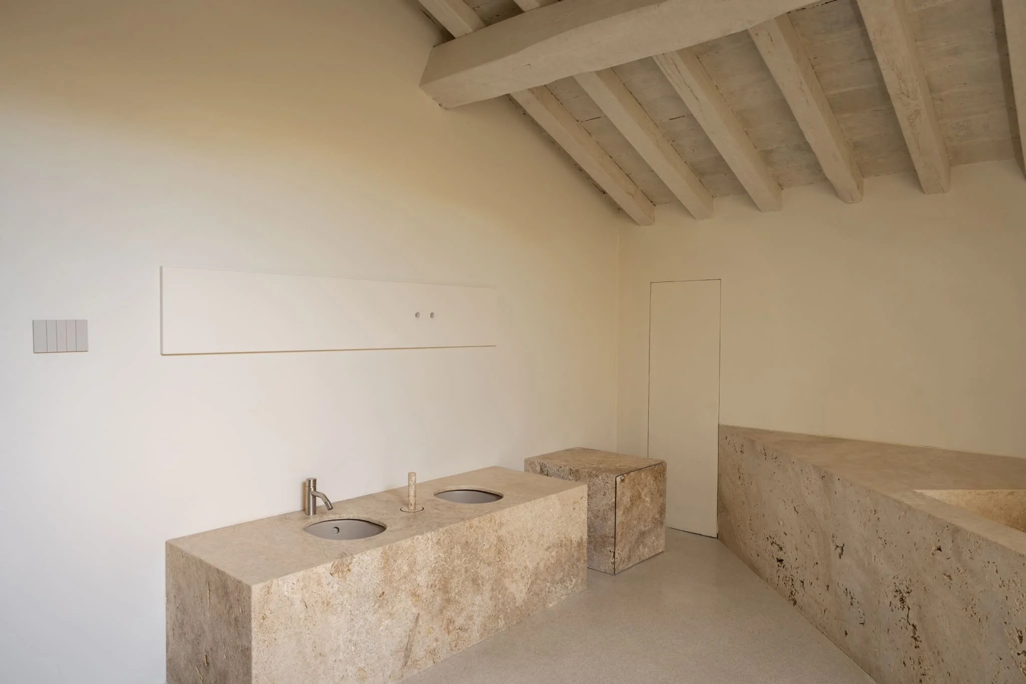 A stone bathroom at Nomos Hotel