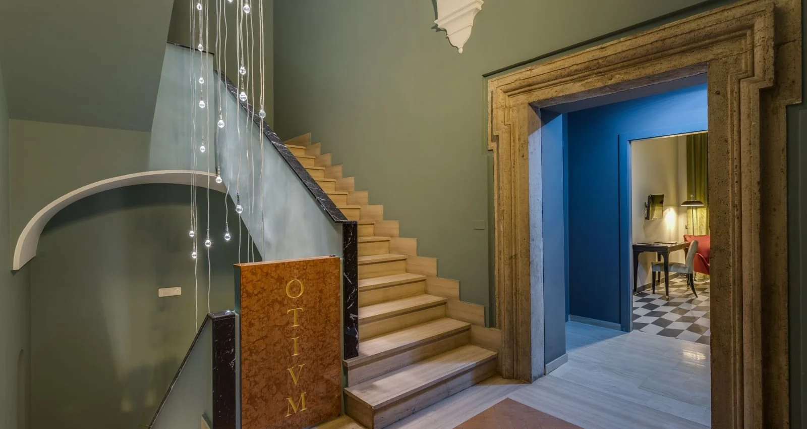 The historic staircase at Otivm Hotel
