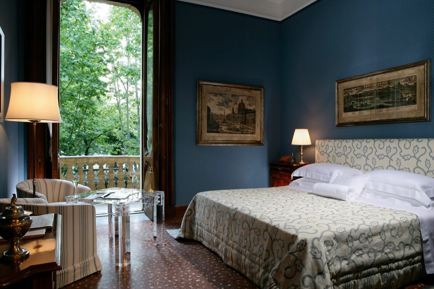 Guest room at Villa Spalletti Trivelli with deep blue walls