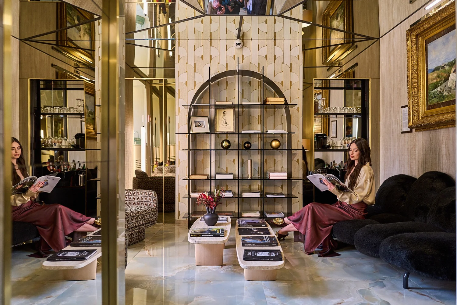 Lounge at Palazzo Manfredi with brass-framed mirrors