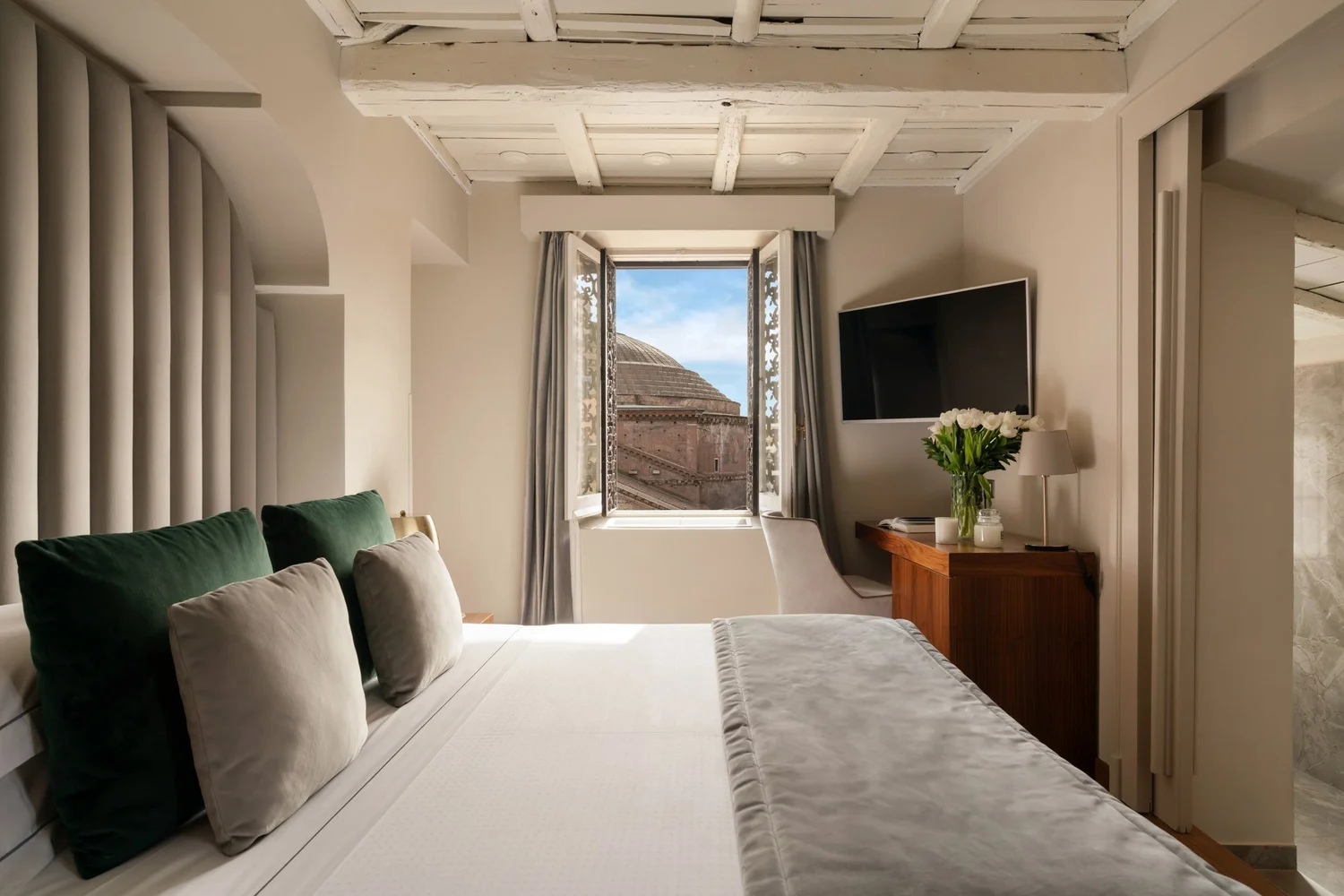 Guest room at the Sole al Pantheon with a window onto the Pantheon dome