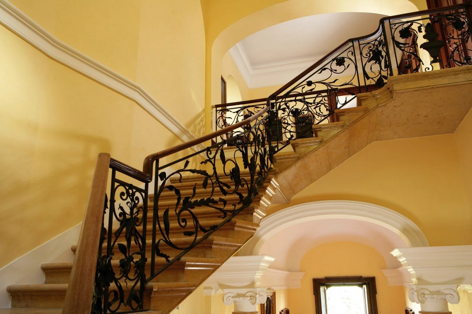 Stone staircase with wrought iron balustrade at Villa Spalletti Trivelli