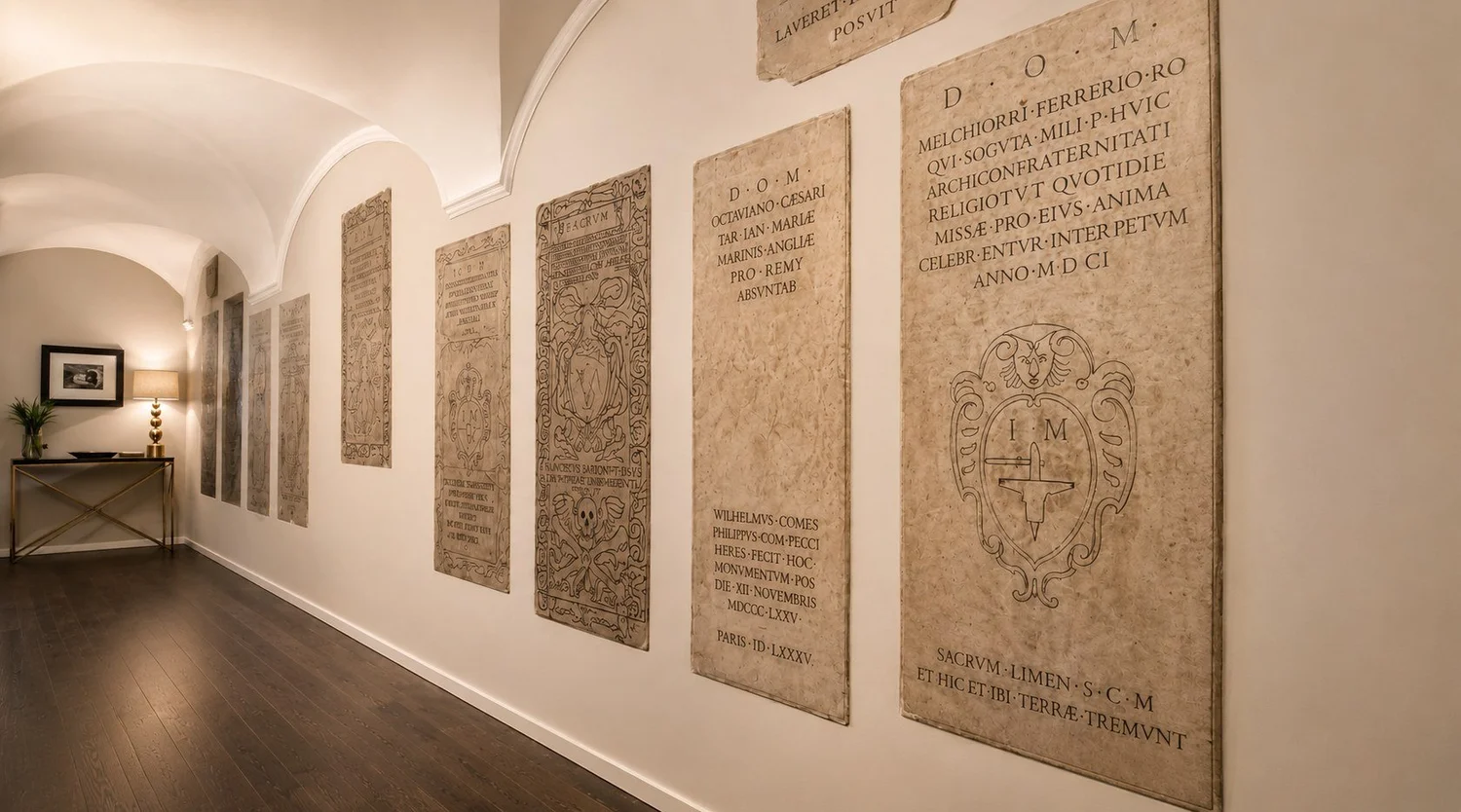 Vaulted corridor with Latin inscriptions at D.O.M Hotel