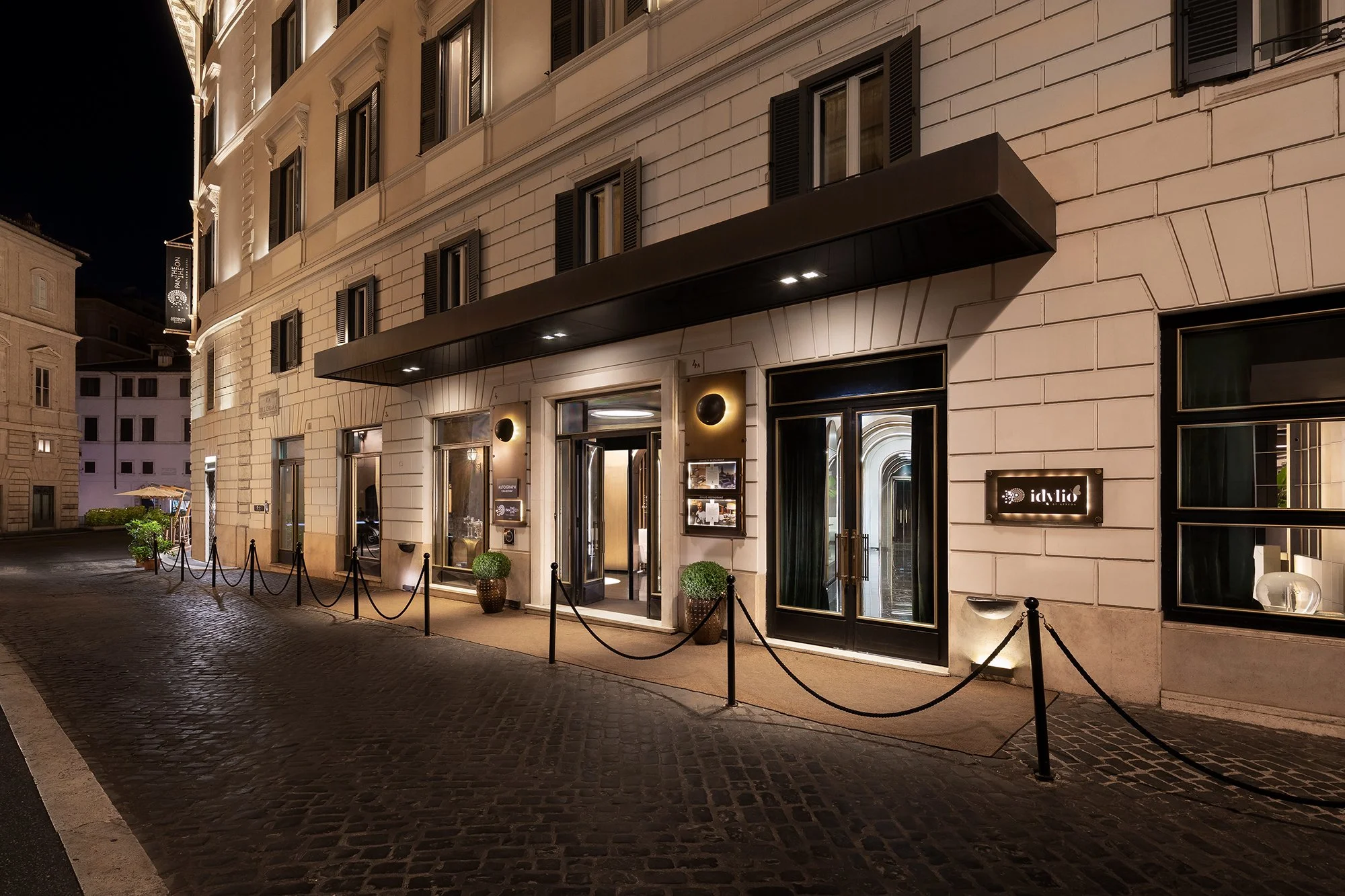 Entrance of The Pantheon Iconic Rome Hotel on Via di Santa Chiara in the evening