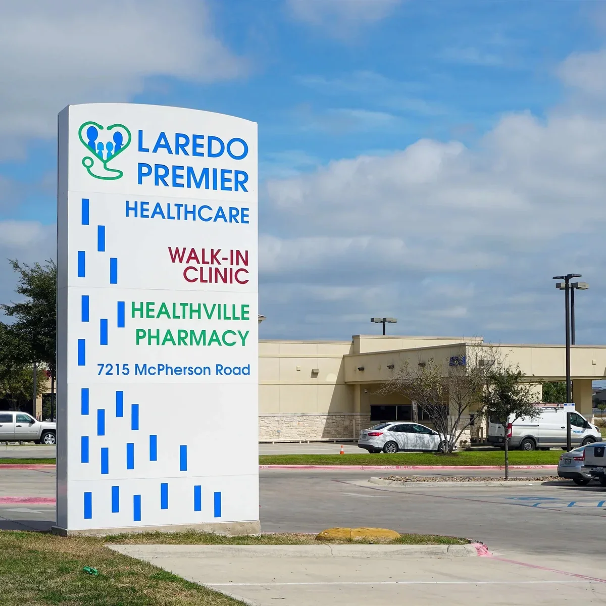Installed monument sign naming Laredo Premier Healthcare, Walk-In Clinic and Healthville Pharmacy.