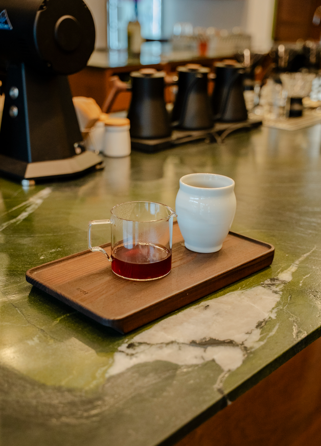Pour-over coffee served in a Korean moon jar at Nomad