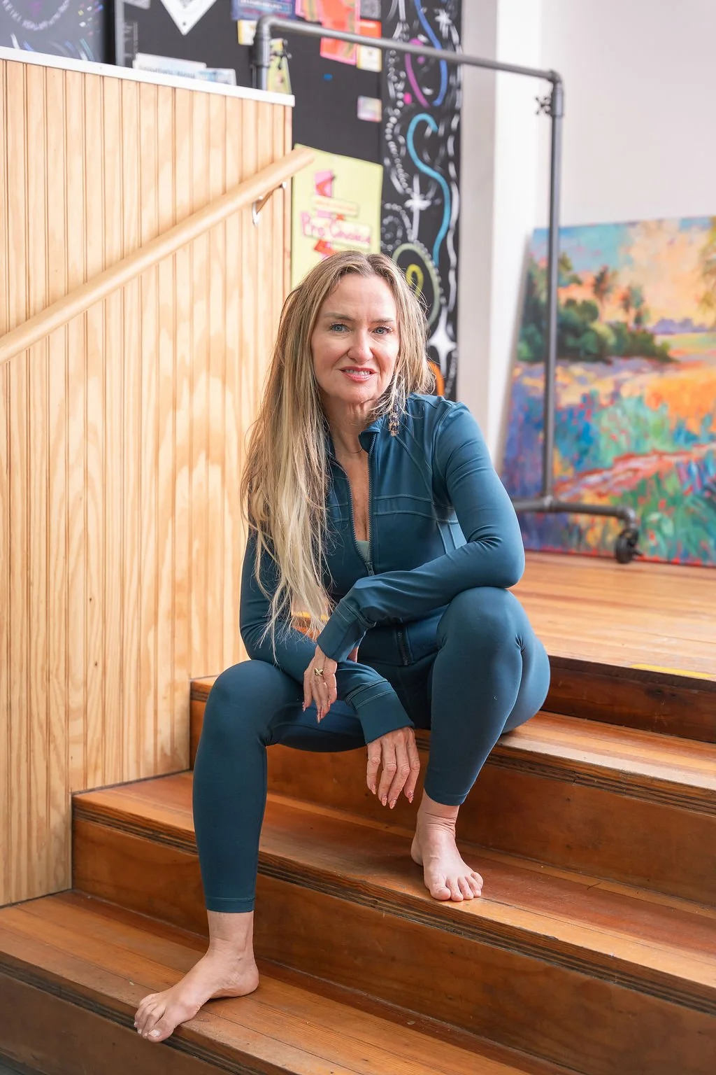 Shelley Carroll seated in the Dancing Dogs Yoga studio in Atlanta