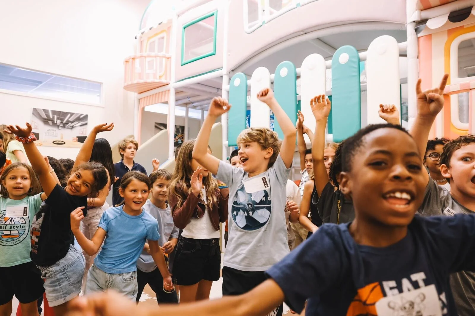 Kids celebrating with hands raised