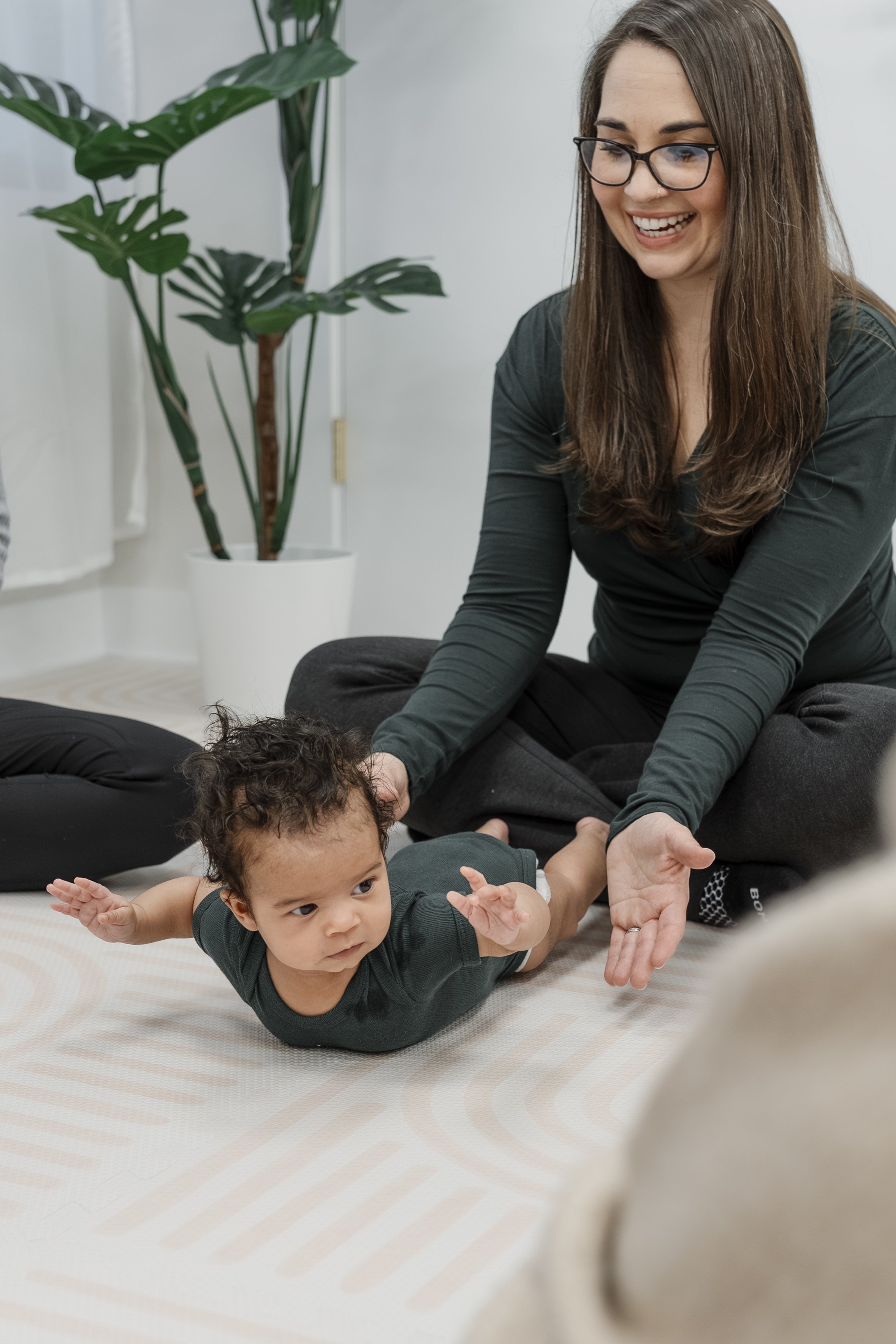 Baby in Be Well Baby onesie