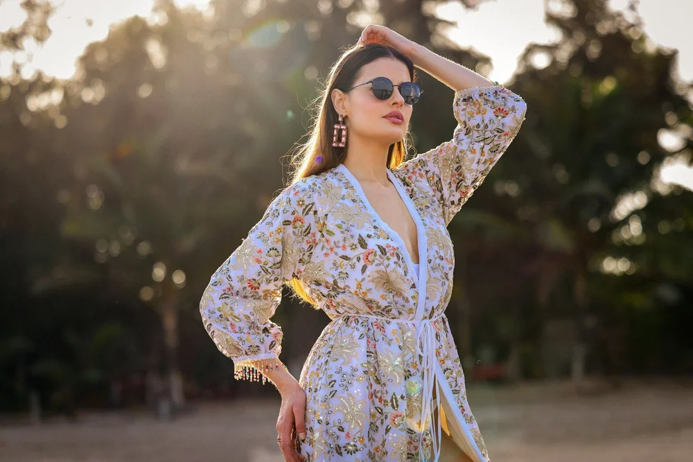 Opal Bloom Kimono in sunlight, showing floral embroidery across the sleeve and bodice.