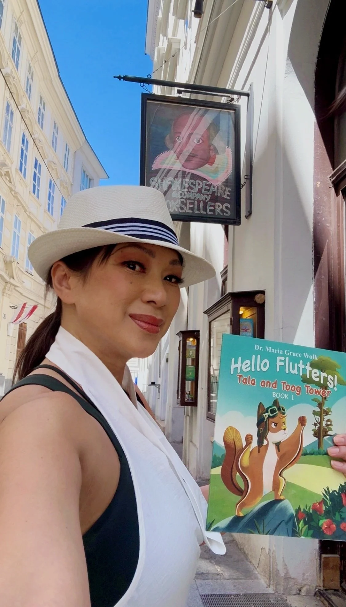 Dr. Maria Grace Wolk outside Shakespeare and Company Vienna with Hello Flutters
