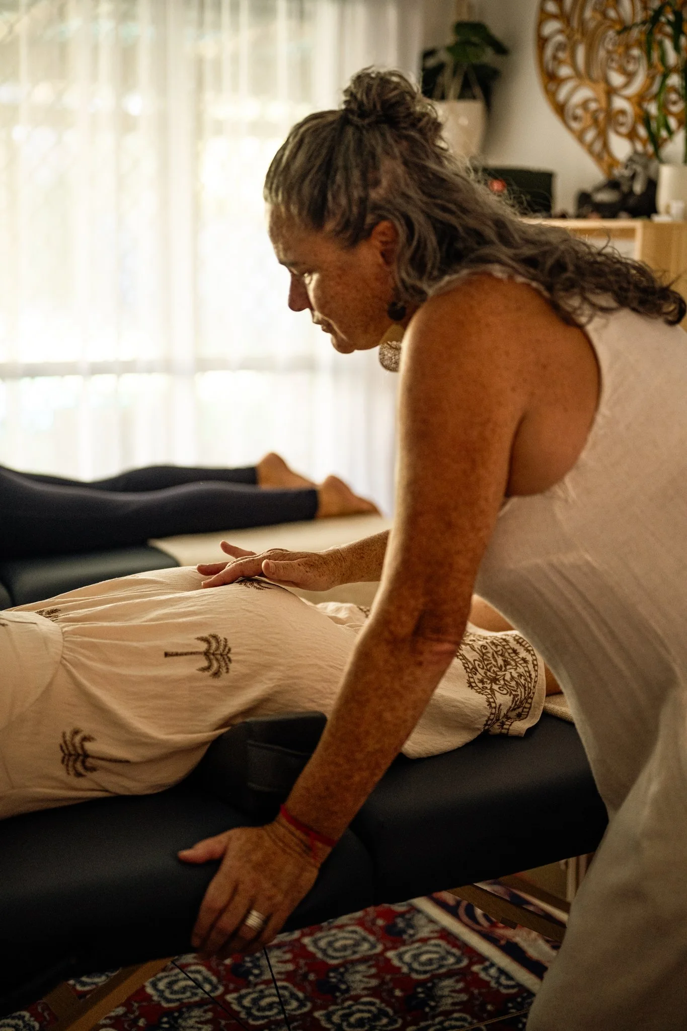 Karon giving a Spinal Flow session at a Healing Intensive Day