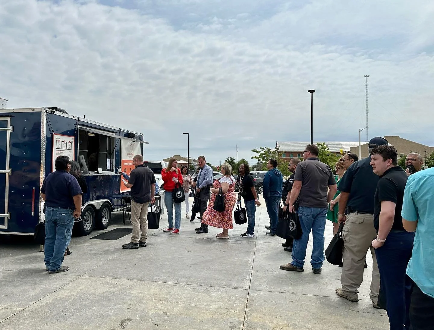 Long line of customers at the Jackie Mays Burger truck in Denton County