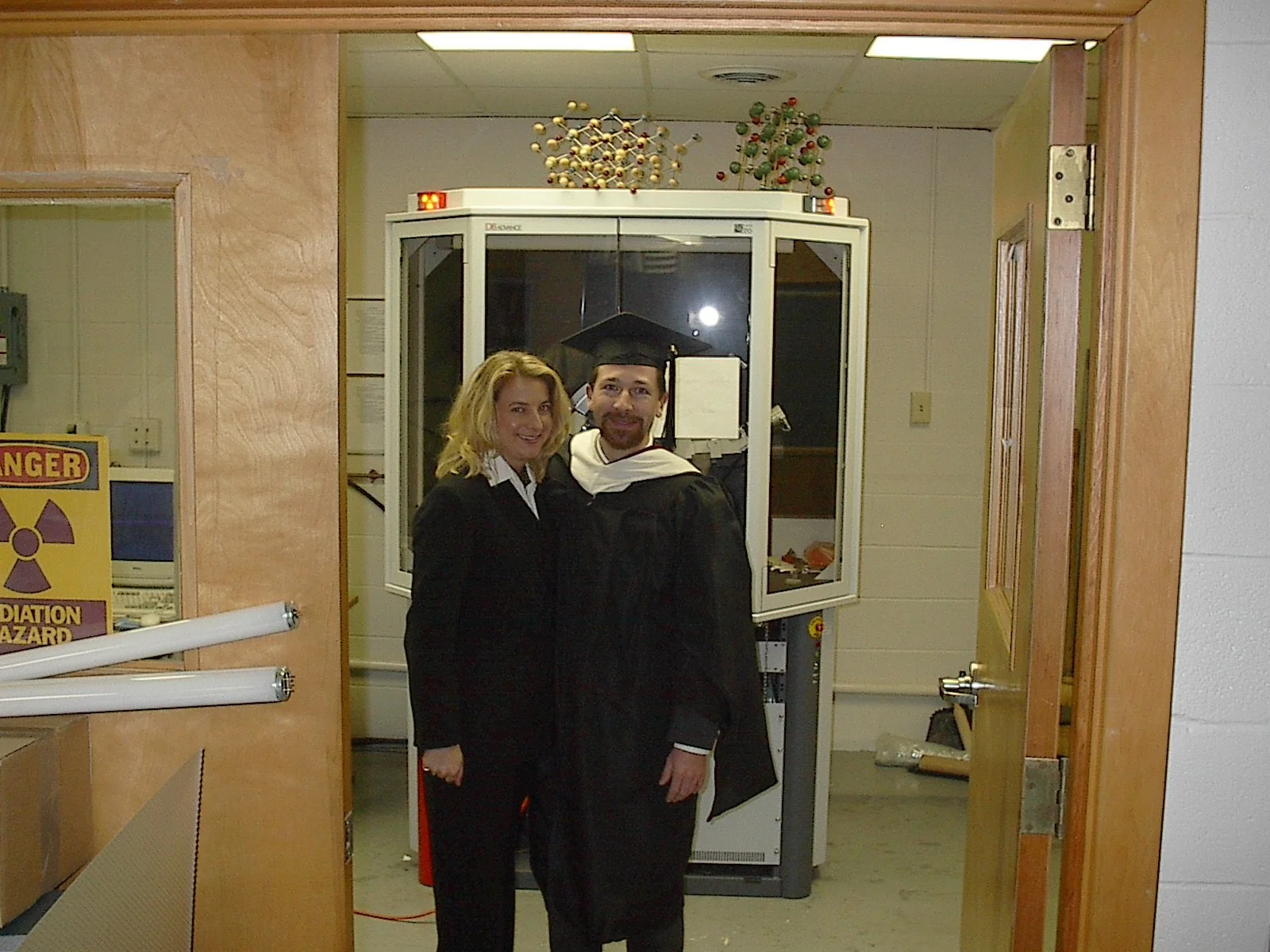 Wargo and his partner after his Masters graduation.