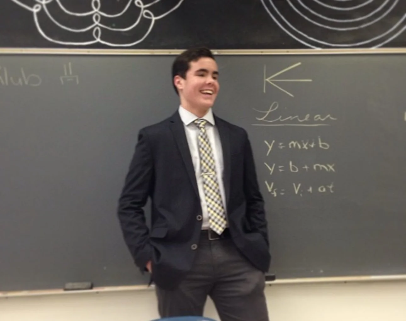 Beckey leading the first ever physics club meeting in 2014.