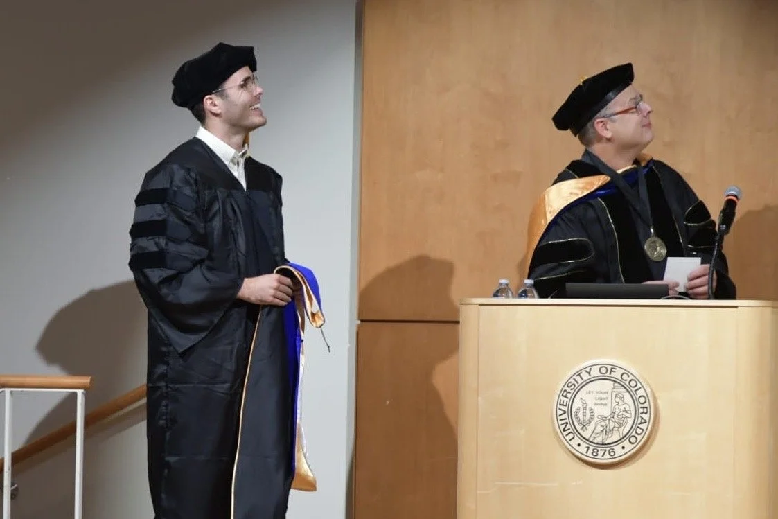 Dr. Beckey at the University of Colorado, Boulder's physics department graduation ceremony.