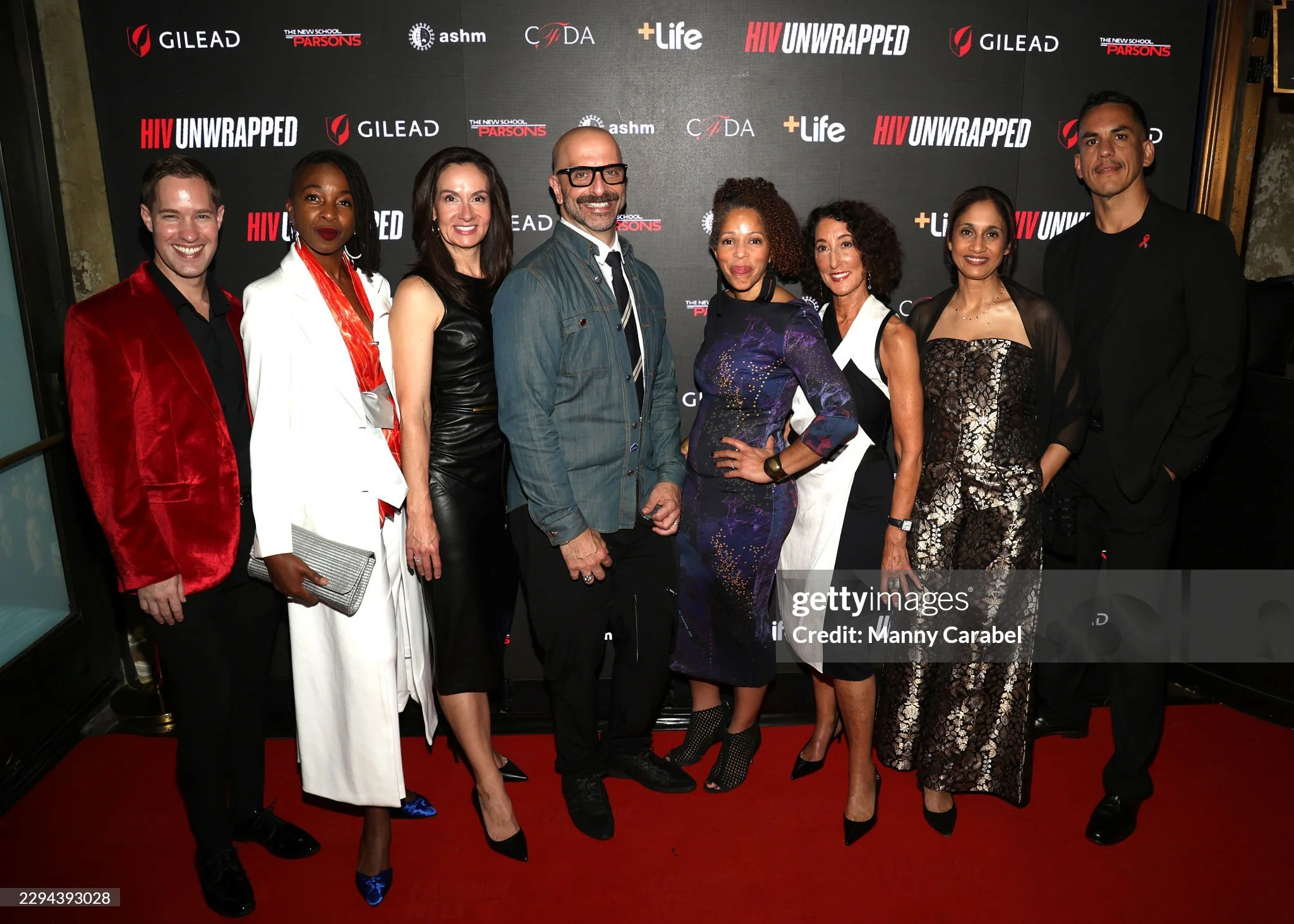 Adam Ward, wearing a red blazer at far left, joins fellow attendees for a group photo at HIV Unwrapped 2.0