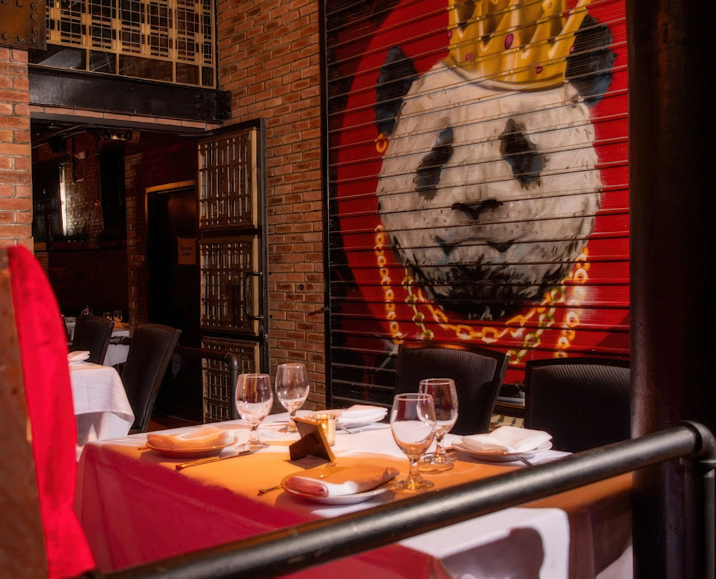 Panda Harlem dining room with warm candlelit ambiance