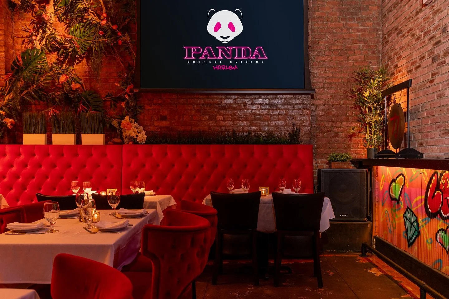 Moody Harlem dining room at Panda Harlem set for date night with warm lighting and cocktails