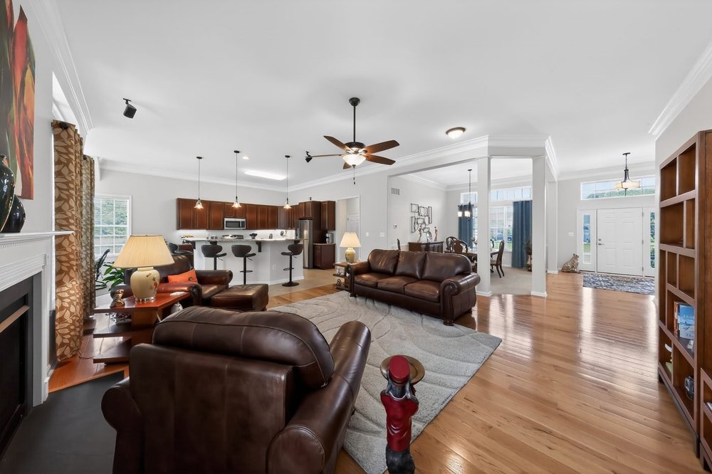 Open-concept living room and kitchen at a Dover, Delaware listing