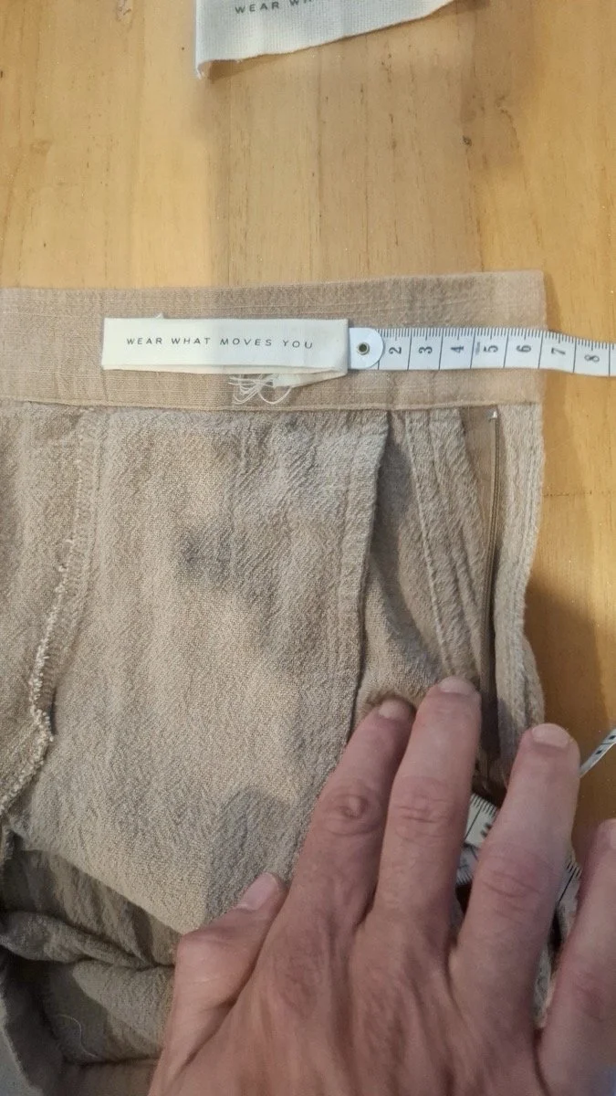 Garment waistband measured by hand with a tape, Nousa Concept