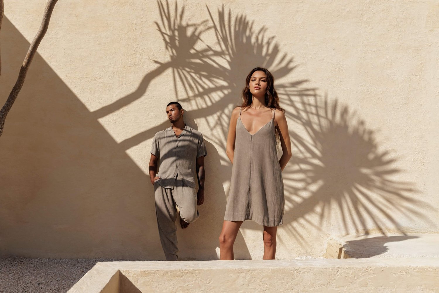 Man and woman wearing Nousa Concept SS26 linen capsule wardrobe in sand tones, Bali campaign